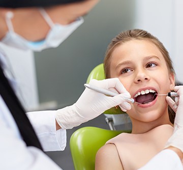 Child receiving tooth extraction