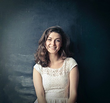 Young teen with attractive smile after clear braces.