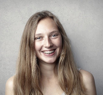 Teen girl with clear braces.