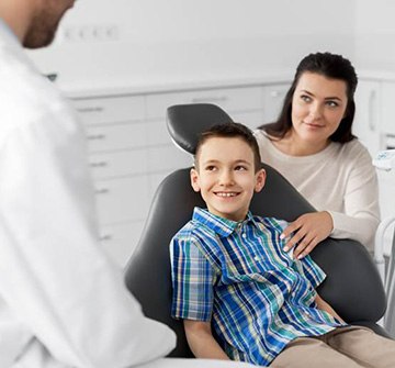 mother with son at dental checkup