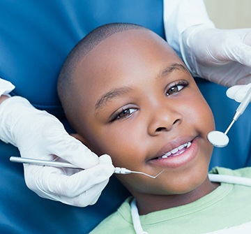 Child smiling while visiting dentist for kids in Pelham