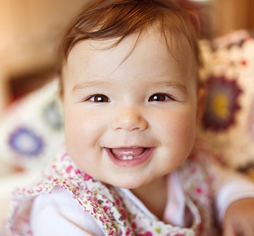 Baby smiling after dentistry for infants