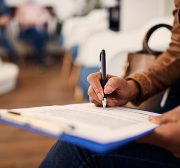 Patient filling out paperwork in lobby