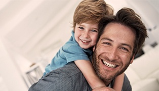 Smiling father and son