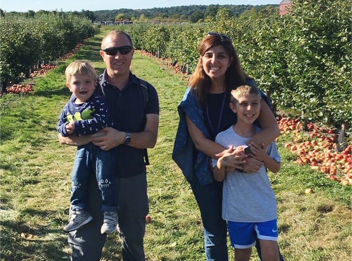 Doctor Boulos and his family at an orchard