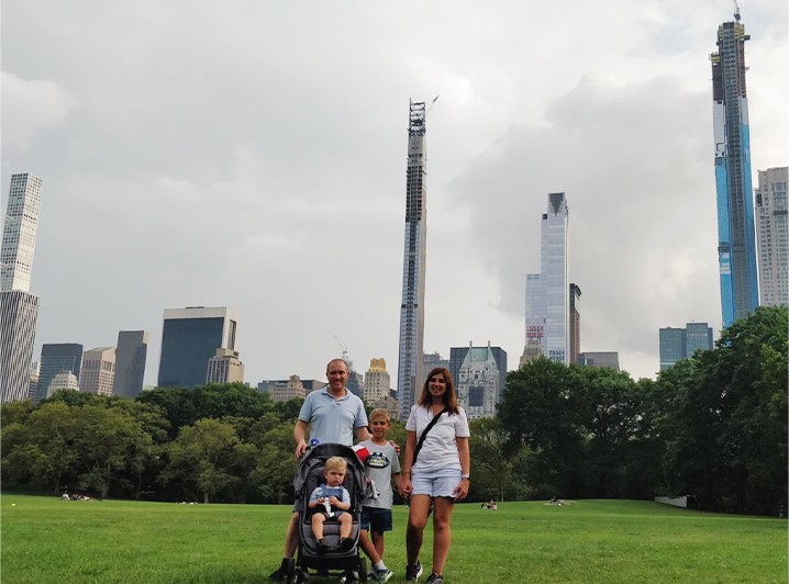 Doctor Boulos and his family with city skyline in background