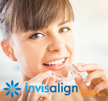 Woman placing invisalign tray