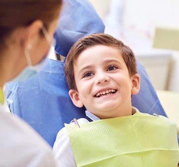 Smiling child during solea laser dentistry appointment