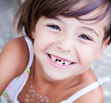 Toddler with missing teeth after tooth extractions