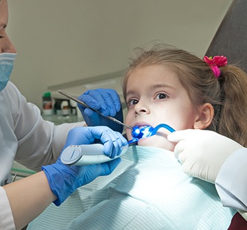 Toddler receiving dental sealants