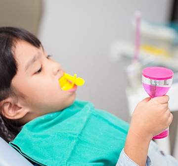 Toddler receiving fluoride treatment