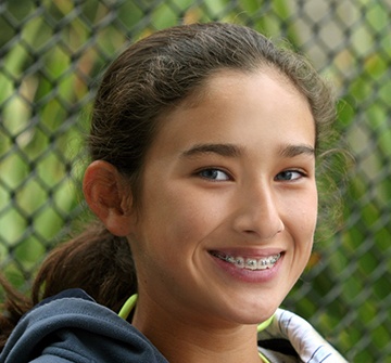 teenager wearing braces in Pelham and smiling