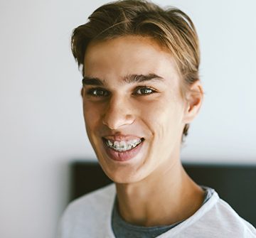 teenager smiling with braces on