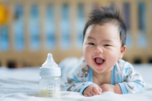 little baby smiles after visiting Pelham pediatric dentist 