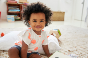 a closeup of a toddler smiling