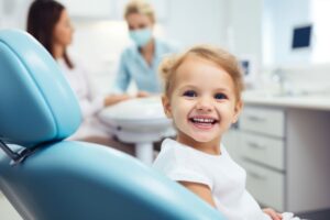 Happy young child in dental treatment chair